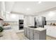 Spacious kitchen with an island cooktop, stainless steel appliances, and plenty of storage at 58 Penn Pl, Zionsville, IN 46077