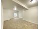 Spacious basement with neutral carpet and recessed lighting at 602 S Sherman Dr, Indianapolis, IN 46203