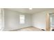 Cozy bedroom with a bright window and updated wood-look flooring at 602 S Sherman Dr, Indianapolis, IN 46203