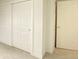 Bedroom with closet door and sliding closet doors leading to ample storage space at 602 S Sherman Dr, Indianapolis, IN 46203