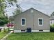 A view of the side of the house with a fenced in backyard at 602 S Sherman Dr, Indianapolis, IN 46203