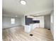 Bright kitchen with stainless appliances, modern cabinetry, dark backsplash and wood flooring at 602 S Sherman Dr, Indianapolis, IN 46203