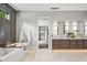 Large bathroom featuring dual sinks, a modern bathtub, walk-in shower and luxury decor at 6115 Stonegate Run, Zionsville, IN 46077