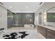 Luxurious bathroom featuring a modern bathtub, walk-in shower, double vanity and stylish tiling at 6115 Stonegate Run, Zionsville, IN 46077