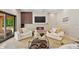Bright living room showcasing a modern fireplace, built-in cabinetry, and plush seating for a comfortable atmosphere at 6115 Stonegate Run, Zionsville, IN 46077