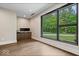 Bright office with large window overlooking green lawn and wood floors at 6115 Stonegate Run, Zionsville, IN 46077