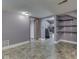Finished basement with updated flooring, neutral paint, and ample storage shelving at 6295 State Road 142 Rd, Martinsville, IN 46151