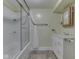 Clean bathroom equipped with tub-shower combination and modern vanity at 6295 State Road 142 Rd, Martinsville, IN 46151