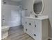 Bathroom with modern vanity, bathtub with shower, and gray floor at 6295 State Road 142 Rd, Martinsville, IN 46151