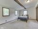 Cozy bedroom with carpeted floor and wooden beam feature at 6295 State Road 142 Rd, Martinsville, IN 46151