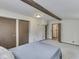 Bright bedroom features carpeted floors, wood beam, and closet space at 6295 State Road 142 Rd, Martinsville, IN 46151