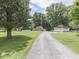 Beautiful brick home with a two-car garage and above-ground pool surrounded by mature trees at 6295 State Road 142 Rd, Martinsville, IN 46151