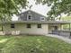 The home's exterior featuring a well-maintained yard and large covered porch at 6295 State Road 142 Rd, Martinsville, IN 46151