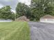 Charming brick home with a two-car garage, above-ground pool and lush green lawn at 6295 State Road 142 Rd, Martinsville, IN 46151