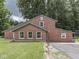 Exterior side view of the brick house showing the clean and well-maintained facade at 6295 State Road 142 Rd, Martinsville, IN 46151