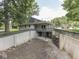 Backyard with large concrete structure and wooded boundary at 6295 State Road 142 Rd, Martinsville, IN 46151