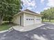 Detached two car garage with white doors at 6295 State Road 142 Rd, Martinsville, IN 46151