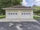 Exterior view of the two-car garage with white doors and siding at 6295 State Road 142 Rd, Martinsville, IN 46151