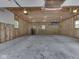 Unfinished two-car garage with concrete floor and wood framing ready for customization at 6295 State Road 142 Rd, Martinsville, IN 46151