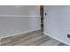 A gray walled hallway with wood-look flooring at 6295 State Road 142 Rd, Martinsville, IN 46151