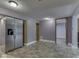 Spacious kitchen area featuring stainless steel refrigerator and easy access to the basement at 6295 State Road 142 Rd, Martinsville, IN 46151