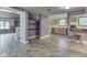Open-concept kitchen features wood cabinets, tile flooring, and convenient bar seating at 6295 State Road 142 Rd, Martinsville, IN 46151