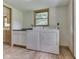 Functional laundry room includes washer, dryer, and counter space at 6295 State Road 142 Rd, Martinsville, IN 46151