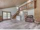 Inviting living room showcasing a wood staircase, hardwood flooring, and an open layout at 6295 State Road 142 Rd, Martinsville, IN 46151