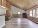 Cozy living room featuring wood accents, vaulted ceilings, and abundant natural light at 6295 State Road 142 Rd, Martinsville, IN 46151