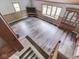 Spacious living room with lots of natural light, wooden floor, and wood paneling at 6295 State Road 142 Rd, Martinsville, IN 46151