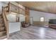 Bright and open living room with vaulted ceilings, wood trim, and hardwood flooring at 6295 State Road 142 Rd, Martinsville, IN 46151