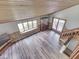 Living room exhibiting vaulted wood ceilings, hardwood floors, and abundant natural light at 6295 State Road 142 Rd, Martinsville, IN 46151