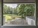 View of the pond and backyard from a covered deck at 6295 State Road 142 Rd, Martinsville, IN 46151