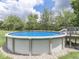 Backyard above ground pool with surrounding deck at 6295 State Road 142 Rd, Martinsville, IN 46151