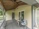 Relax on the spacious porch of this home, complete with comfortable seating at 6295 State Road 142 Rd, Martinsville, IN 46151