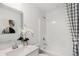 Clean, bright bathroom with modern vanity, shower/tub combo, and stylish accents at 6580 Halsey St, Zionsville, IN 46077