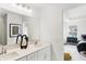 Clean, bright bathroom featuring a double vanity with white cabinets and a view into the bedroom at 6580 Halsey St, Zionsville, IN 46077