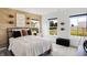 Sports themed bedroom with a wood-accent wall, large windows and modern decor at 6580 Halsey St, Zionsville, IN 46077
