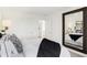 Spacious bedroom featuring a large mirror, closet access, and neutral decor at 6580 Halsey St, Zionsville, IN 46077