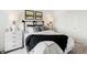 Comfortable bedroom showcases an accent wall, coordinating lamps, and a cozy bedding set at 6580 Halsey St, Zionsville, IN 46077