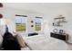 Bright bedroom featuring two windows, modern furnishings, and stylish décor at 6580 Halsey St, Zionsville, IN 46077