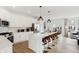 Bright, modern kitchen features white cabinets, stainless steel appliances, a spacious island, and an open layout at 6580 Halsey St, Zionsville, IN 46077