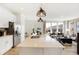 Open kitchen features a large island, stainless appliances, and sightlines into the adjacent living room at 6580 Halsey St, Zionsville, IN 46077