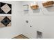 Functional laundry room offers ample storage, decorative wall art, and modern connections at 6580 Halsey St, Zionsville, IN 46077