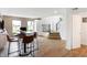 Spacious open-concept living area with hardwood floors, a staircase, and stylish furnishings at 6580 Halsey St, Zionsville, IN 46077