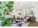 Inviting living area features modern decor, stylish chairs, ample natural light, and a neutral color palette at 6580 Halsey St, Zionsville, IN 46077