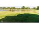 Expansive lawn extending to a serene pond, surrounded by lush trees, offers a tranquil and picturesque backyard at 6610 Aberdeen Dr, McCordsville, IN 46055