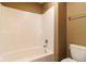 Well-lit bathroom with white bathtub/shower combo and modern fixtures, offering a clean and functional space at 6610 Aberdeen Dr, McCordsville, IN 46055