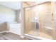 Bathroom featuring shower, soaking tub, and tile flooring, perfect for relaxation at 6610 Aberdeen Dr, McCordsville, IN 46055