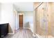 Bathroom featuring a shower with glass doors, soaking tub, and modern fixtures at 6610 Aberdeen Dr, McCordsville, IN 46055